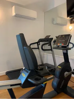Wall-mounted air conditioning unit in a home gym
