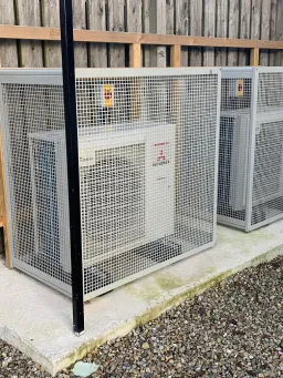 Outdoor air conditioning unit being serviced